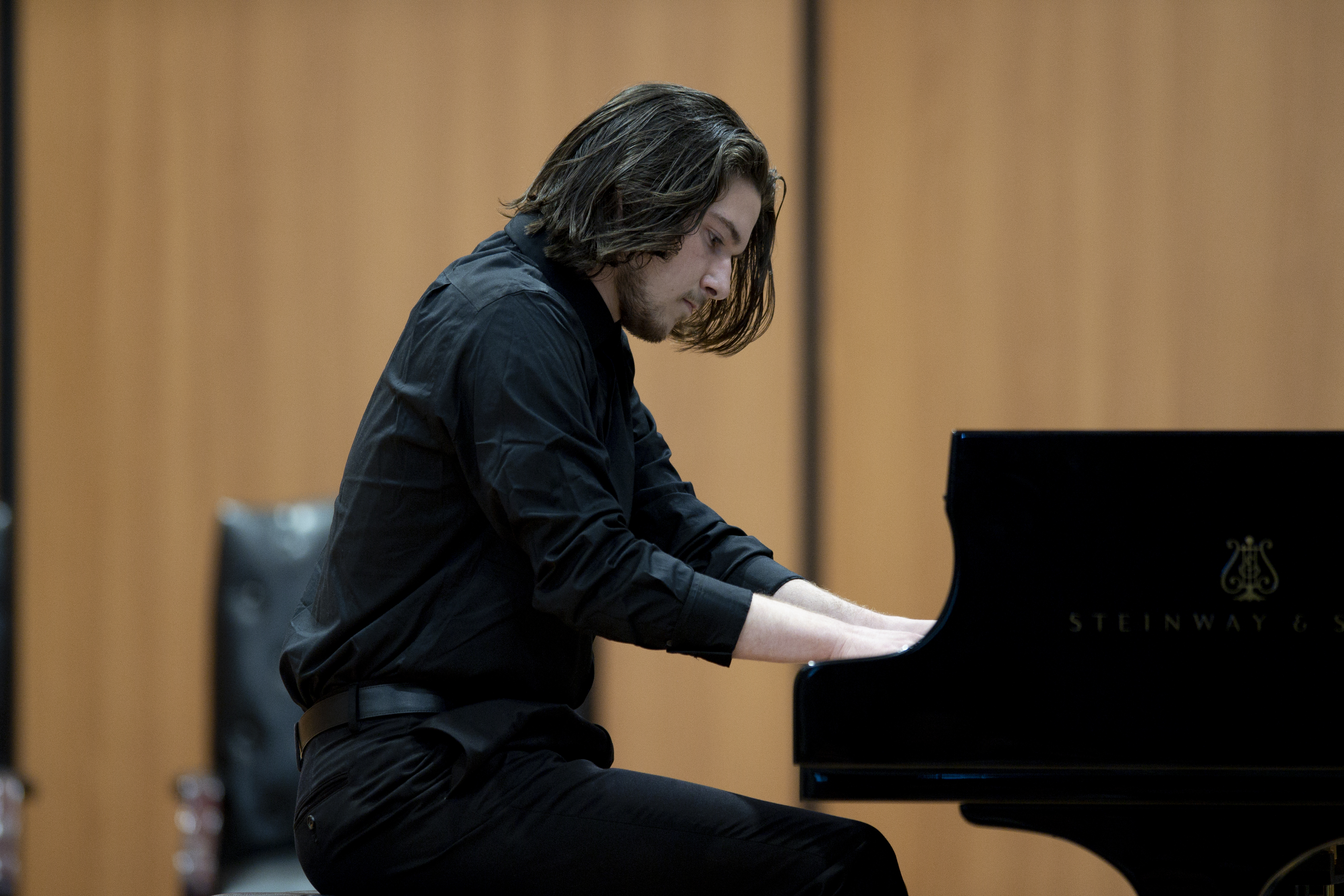 Performer plays piano